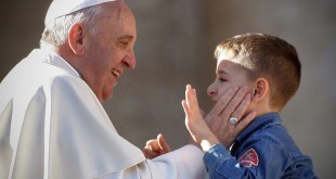 VATICAN CITY, VATICAN - FEBRUARY 14:  Pope Francis greets a boy as he attends a meeting with engaged couples from all over the world gathered today, on the feast of St. Valentine, in St. Peter's Square February 14, 2014 in Vatican City, Vatican. During the event, organised by the Pontifical Council for the Family, Pope Francis emphasised that living together is 'an art, a patient, beautiful and fascinating journey' which can be summarized in three words: please, thank you and sorry. (Photo by Franco Origlia/Getty Images)