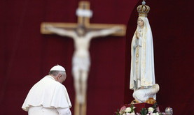 Pope Francis pays homage to the statue of St. Mary of Fatima at the end of the Marian prayer in St. Peter's square at the Vatican, Saturday, Oct. 12, 2013. (AP Photo/Riccardo De Luca)