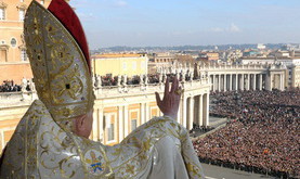 In this photo released by the Vatican's L'Osservatore Romano newspaper,  Pope Benedict XVI delivers his blessing to the faithful gathered in St. Peter's Square at the Vatican, from the velvet-draped loggia of St. Peter's Basilica, during the "Urbi et Orbi" message, Latin for ''to the city and to the world", Tuesday, Dec. 25, 2007. The pontiff issued a Christmas Day appeal  to political leaders around the globe to find the "wisdom and courage'' to end bloody conflicts in Darfur, Iraq, Afghanistan and the Congo. (AP Photo/L'Osservatore Romano, HO)